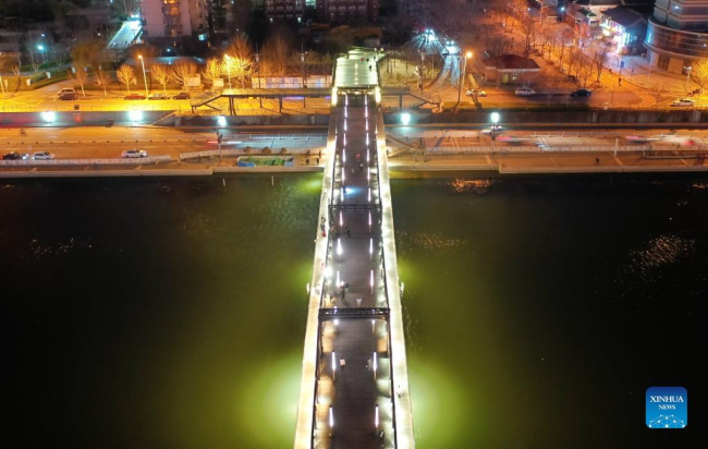Αεροφωτογραφία που τραβήχτηκε στις 28 Μαρτίου 2022 δείχνει τη γέφυρα Τζιν’τανγκ πάνω από τον ποταμό Χαϊχέ στο Τιεντζίν της βόρειας Κίνας. [Φωτογραφία/Xinhua]